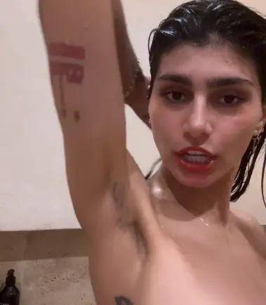 Shaving her armpits